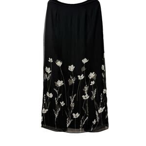 Ann Taylor woman's black skirt with white flowers in size 4